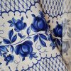 Waffle fabric with blue flowers, 50 cm wide.