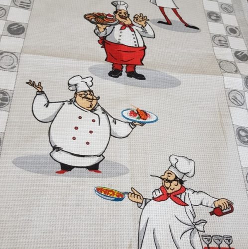 Waffle fabric with cheerful chefs, 50 cm wide.